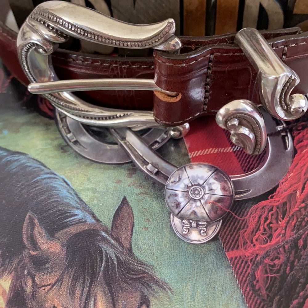 Woman’s Leather Belt Embellished with Decorative Silver Hardware